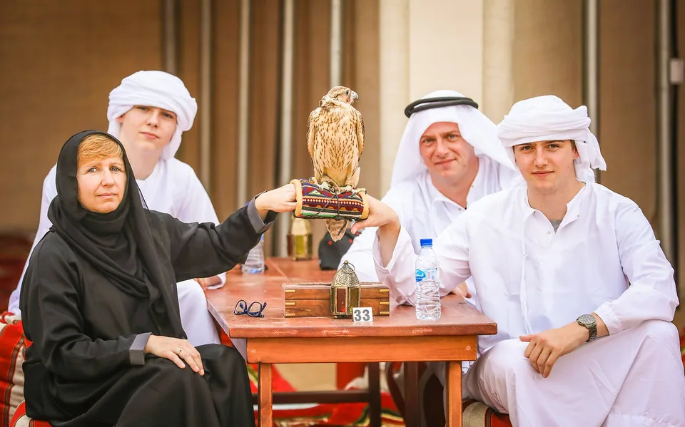 Guests seated for Arabic coffee at a desert camp